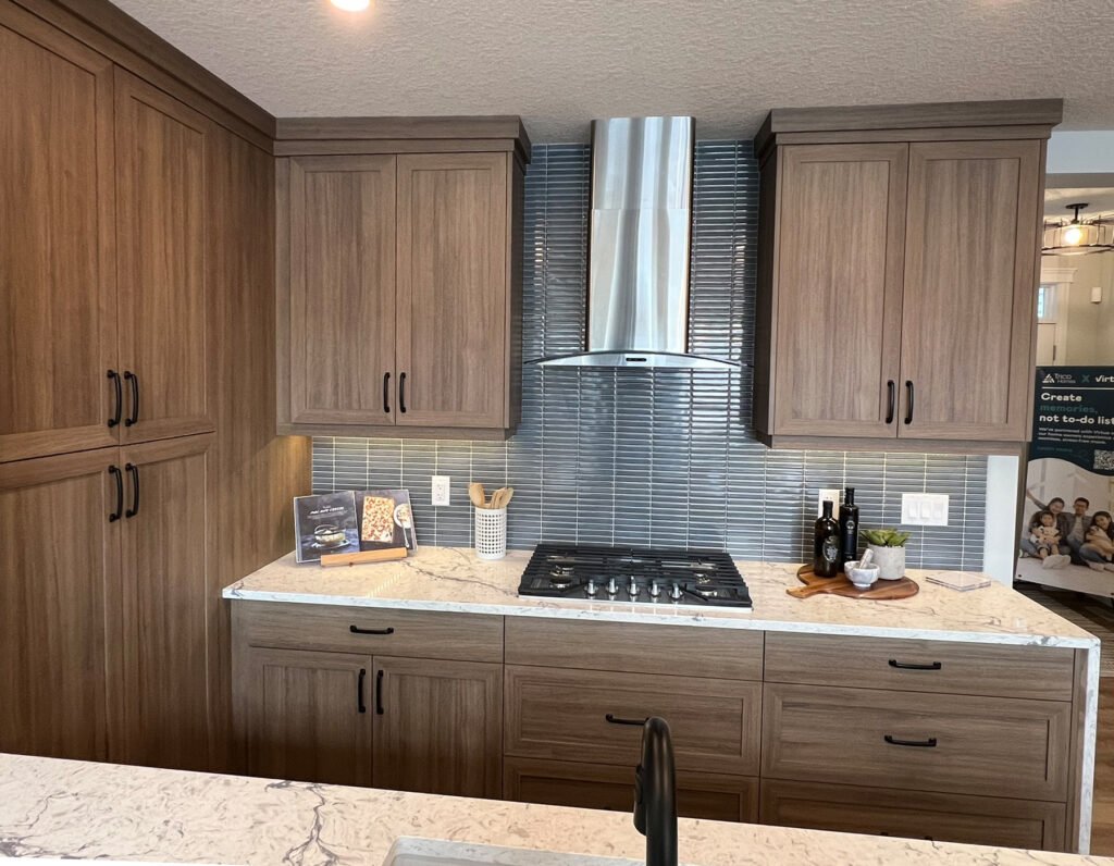 Full brown kitchen with rich wood cabinetry and quartz countertop – custom installation by Coldii Inc. in Calgary
