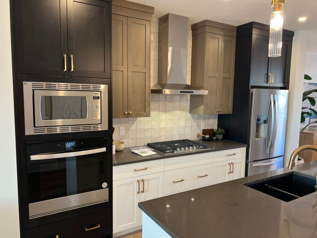 odern kitchen with elegant built-in stove, microwave, and refrigerator – designed by Coldii Inc. in Calgary
